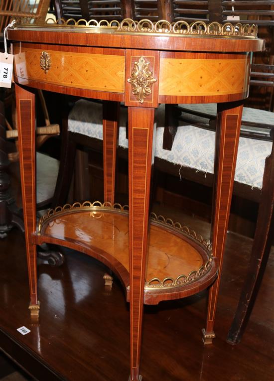 A French cross banded maple and marquetry oval occasional table, W. 2ft. D. 1ft 5in. H. 2ft 6in.